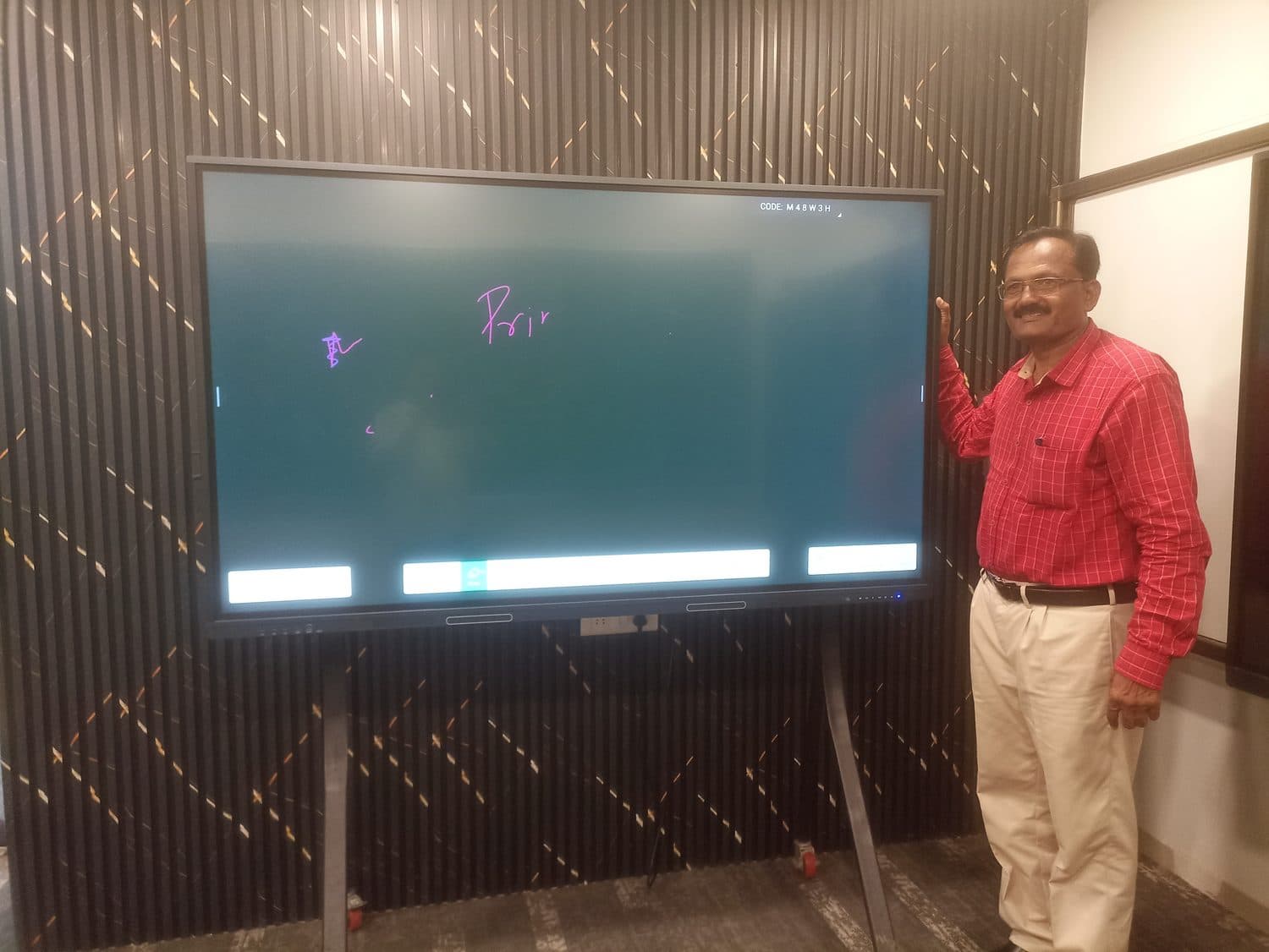 Interactive flat panel in its wall enclosure