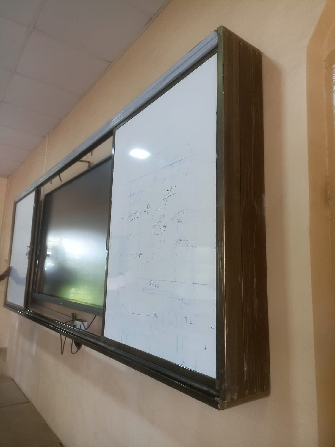 Interactive flat panel with sliding whiteboards, installed