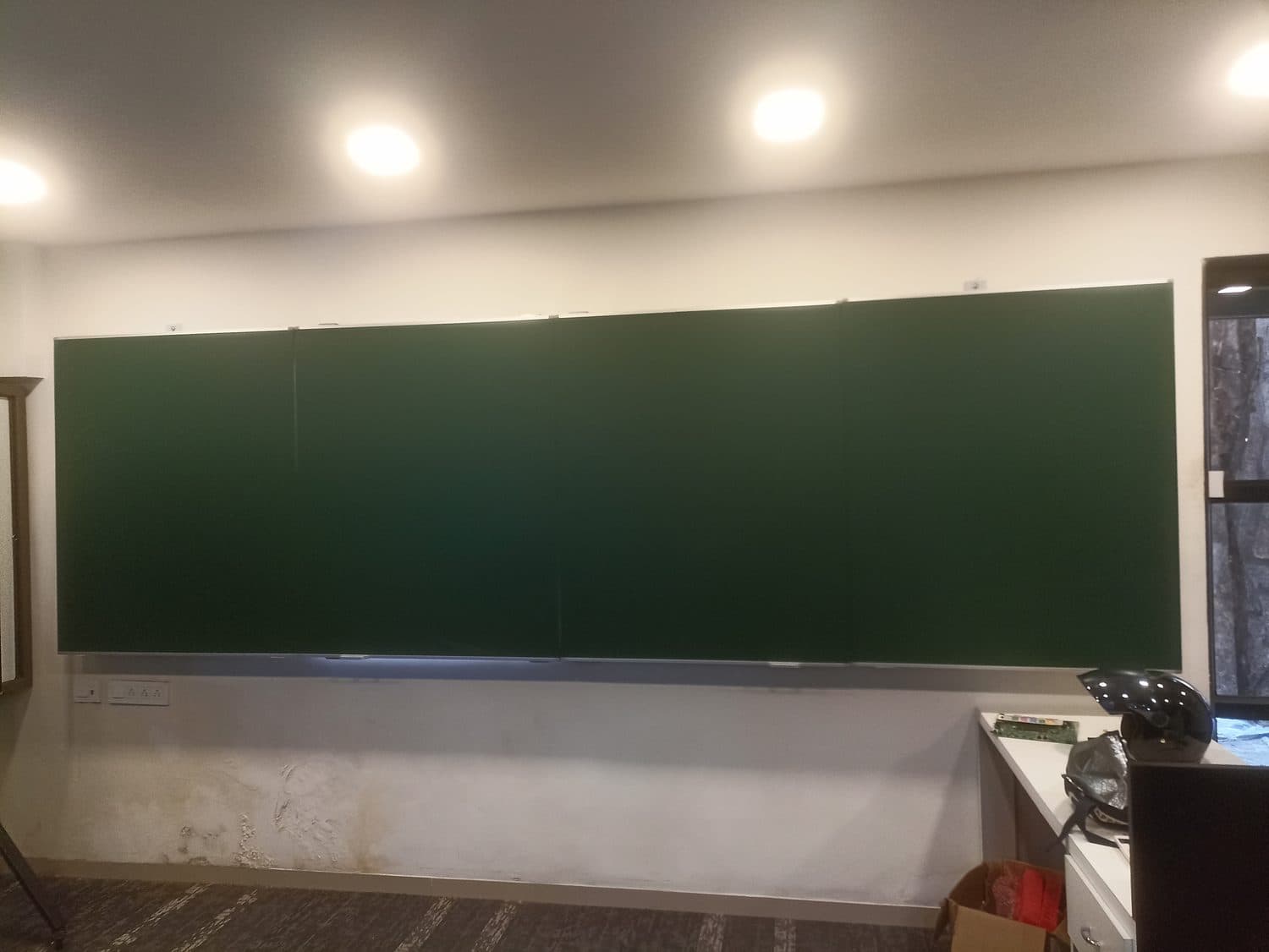 Full-width green chalk board, lecture hall